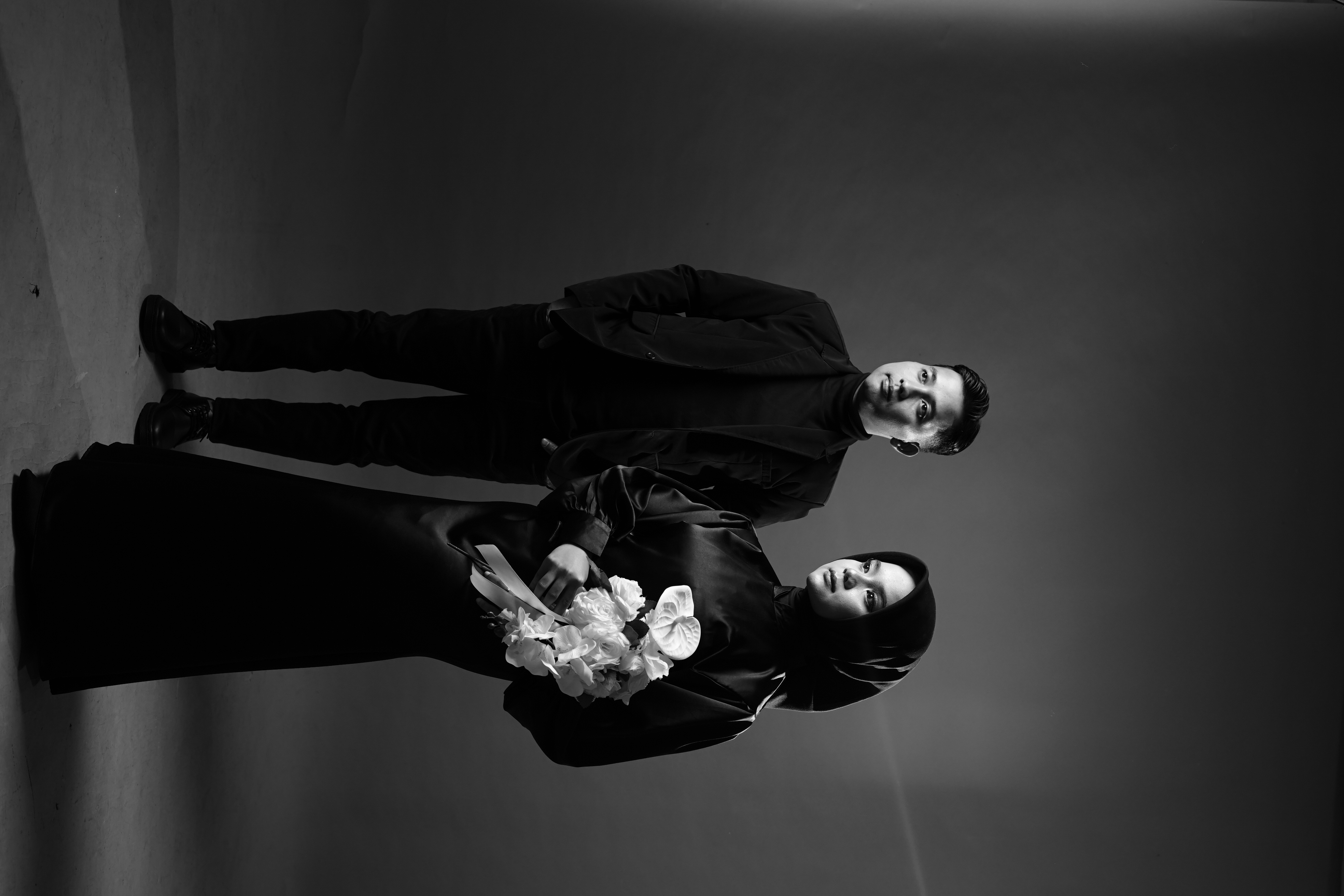 Couple praying together in garden